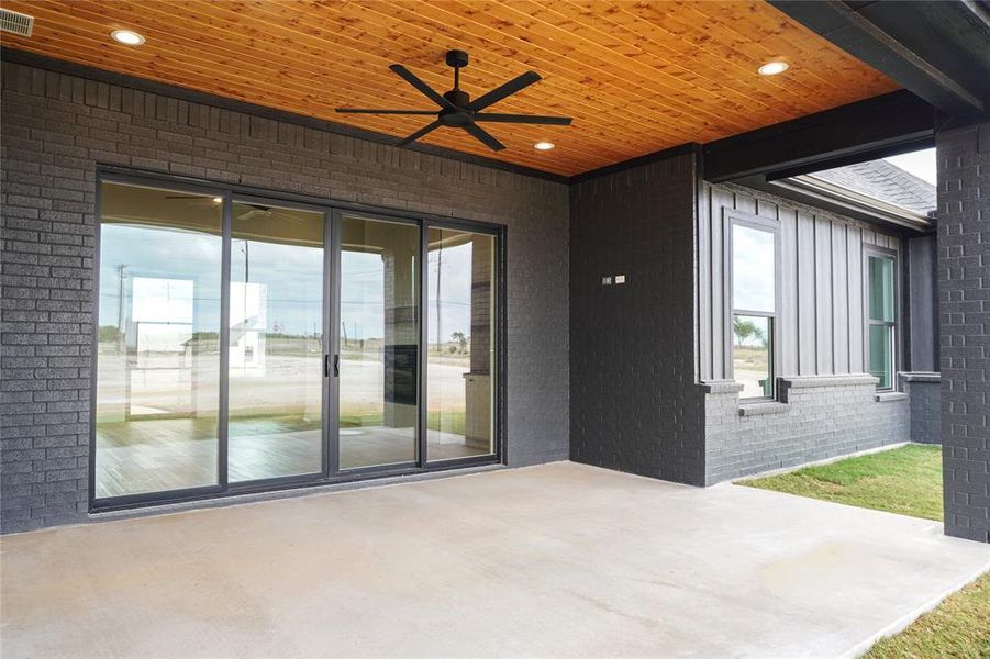 View of patio featuring ceiling fan