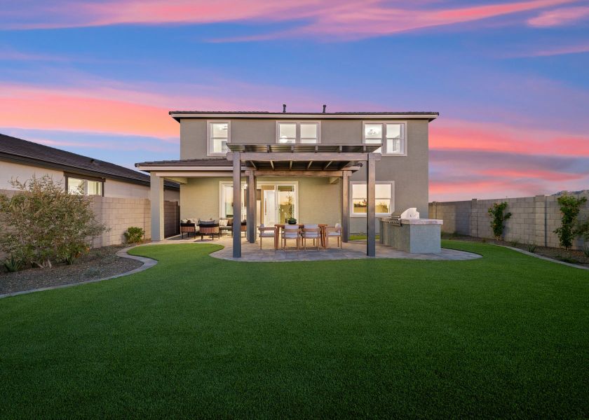 A house with a lawn and a large front yard.