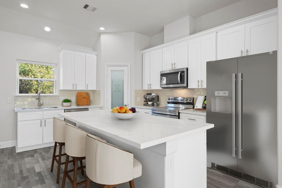 Virtually Staged: This beautiful kitchen features a bright, modern design with white shaker cabinets, soft-close drawers, and sleek brushed-nickel hardware. The large center island offers generous counter space for meal prep and seating for casual dining.