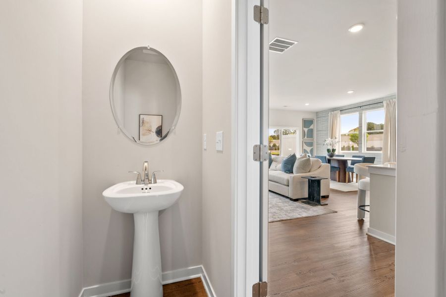 A bathroom with a sink and a bed. A bathroom with a sink and a bed.