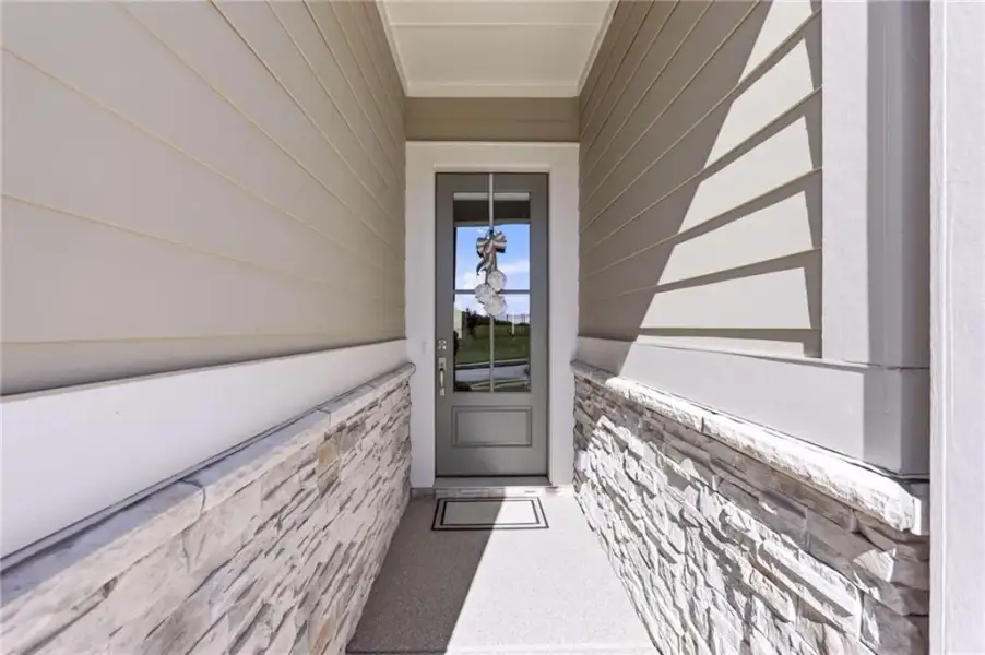 Exterior details and patio area of a home in The Retreat at Sterling on the Lake 48', Flowery Branch (Image 4).
