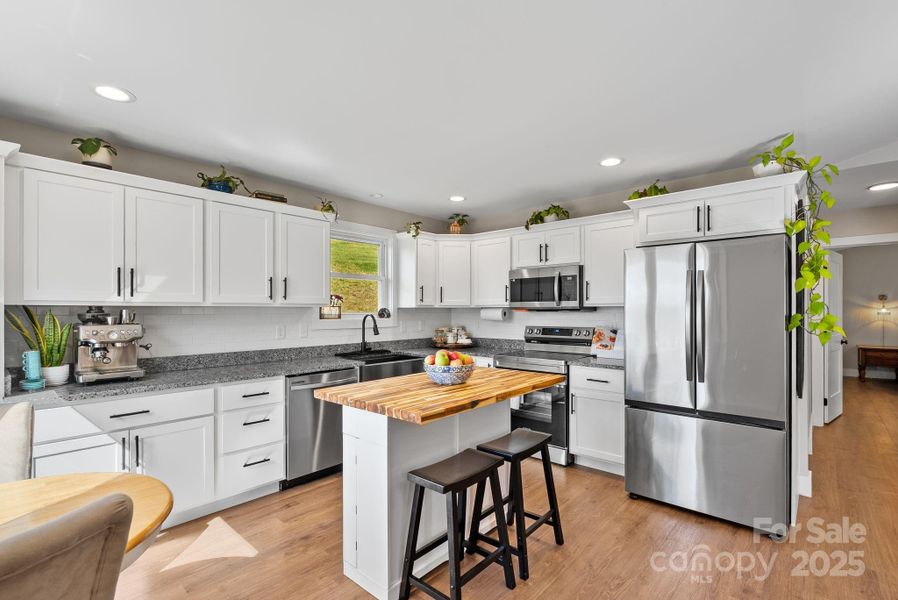 Gorgeous open kitchen with granite counters, stainless appliances, deep stainless sink & soft close cabinetry. Gorgeous open kitchen with granite counters, stainless appliances, deep stainless sink & soft close cabinetry.