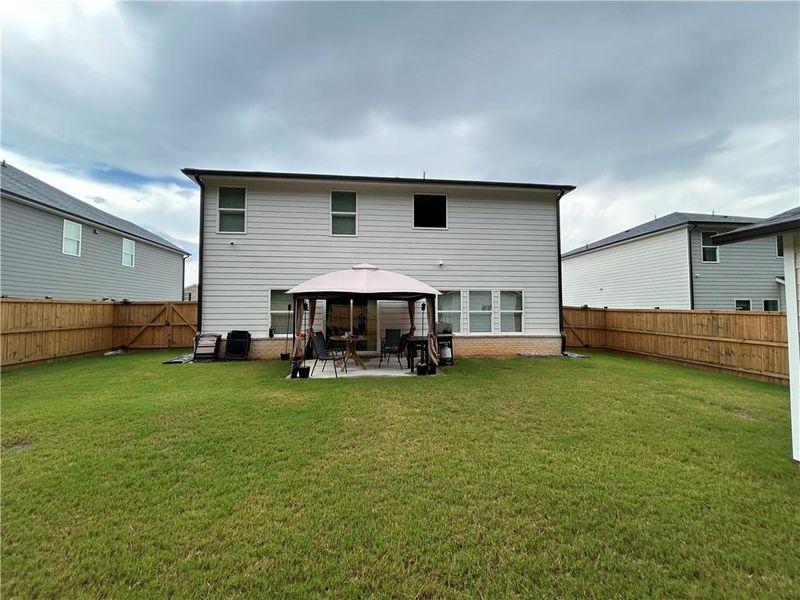 Front exterior of a new home in , Loganville, GA, highlighting curb appeal (Image 24).