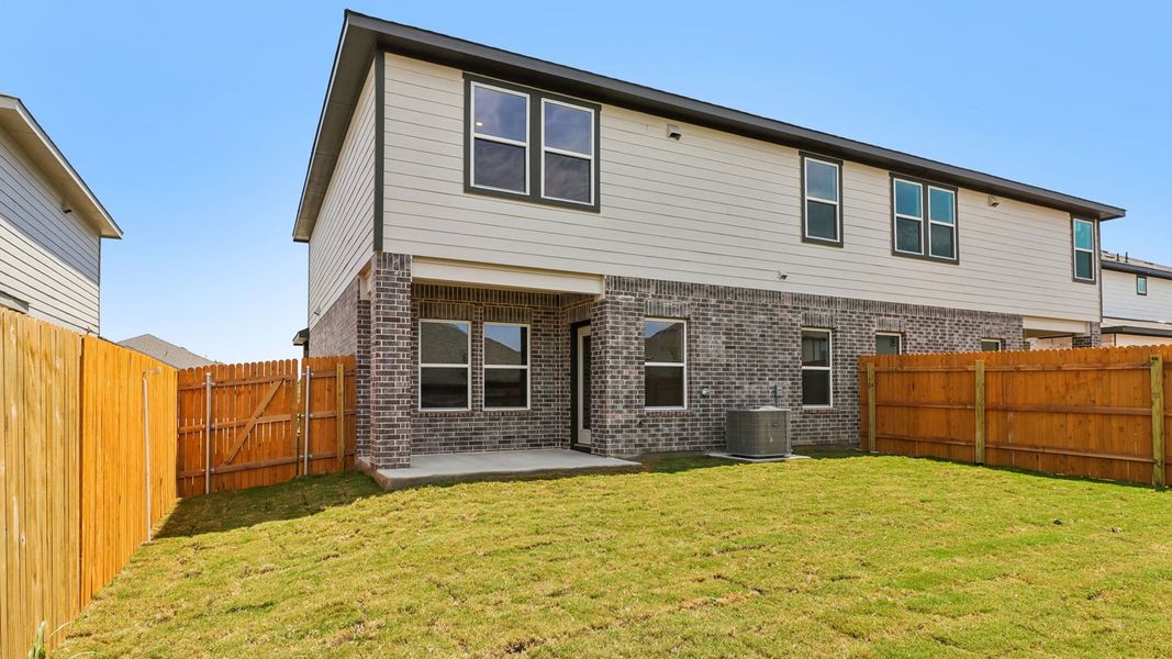 Exterior details and patio area of a home in Palomino, Manor (Image 20).