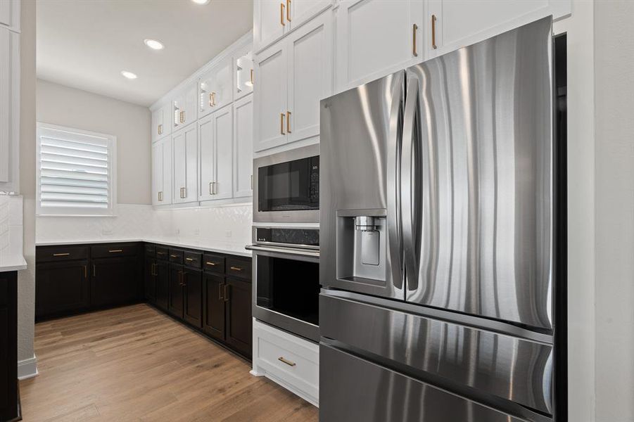 Furnished interior view inside a new home in Pecan Square - Estates, Northlake (Image 20).