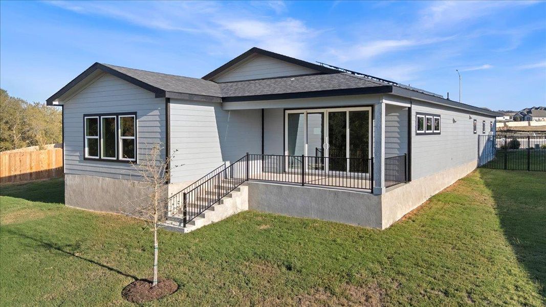 Back of property featuring a shingled roof Back of property featuring a shingled roof
