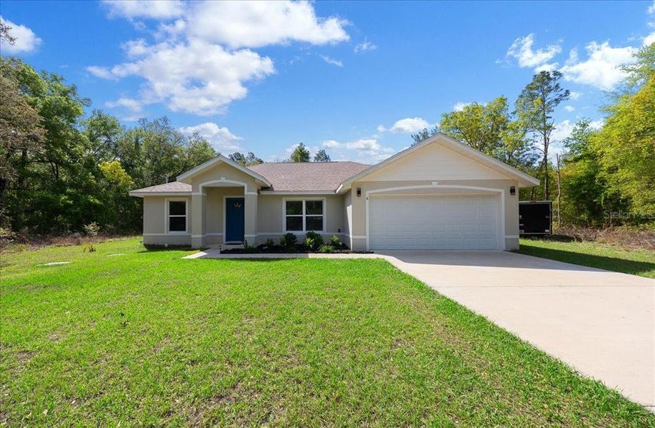 Front exterior of a new home in , Ocklawaha, FL, highlighting curb appeal (Image 19). Front exterior of a new home in , Ocklawaha, FL, highlighting curb appeal (Image 19).