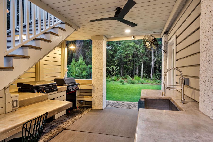 Exterior details and patio area of a home in Overlook at Copahee Sound, Awendaw (Image 27).