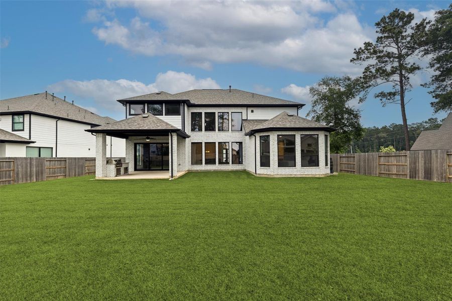 Exterior details and patio area of a home in , Conroe (Image 3).
