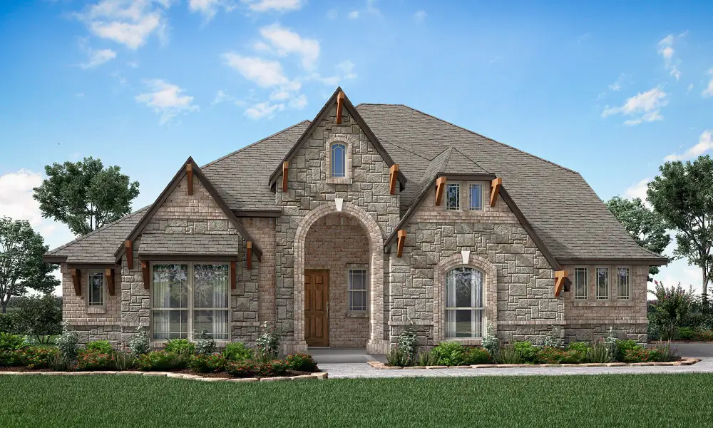 Single-story home with stone exterior, arched entryway, and pitched roof with decorative wood accents