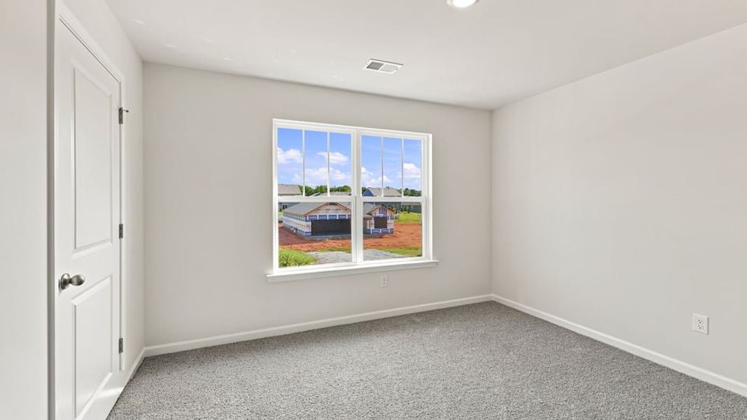 Spacious, unfurnished interior of a new home in Bentley Park, Greenwood (Image 25).