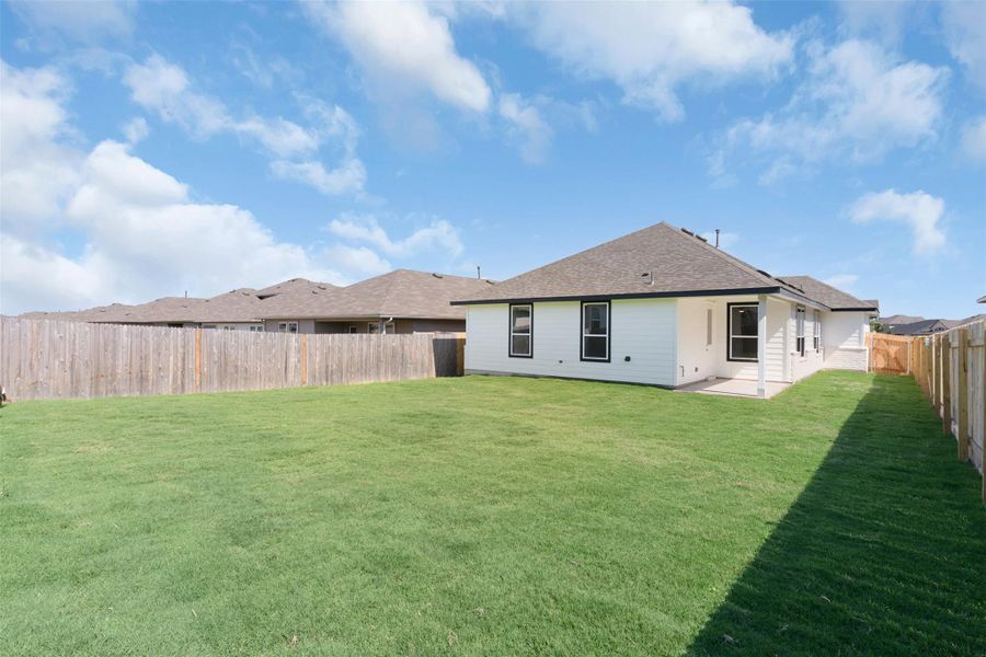 Rear view of property with a patio, a fenced backyard, and a shingled roof Rear view of property with a patio, a fenced backyard, and a shingled roof