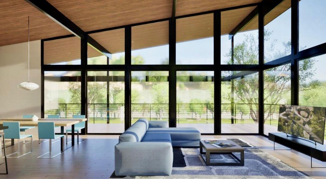 Living room featuring expansive windows, wood finished floors, and high vaulted ceiling Living room featuring expansive windows, wood finished floors, and high vaulted ceiling