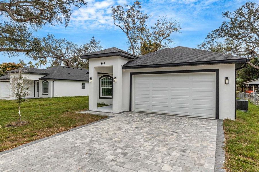 Front exterior of a new home in , Tampa, FL, highlighting curb appeal (Image 26).