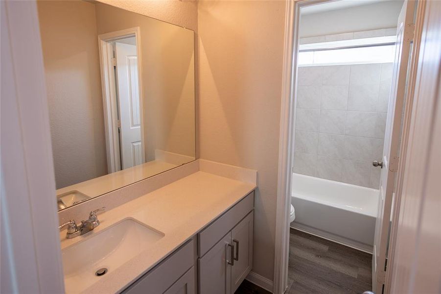 Second full bathroom featuring modern fixtures, ample counter space, and stylish finishes.