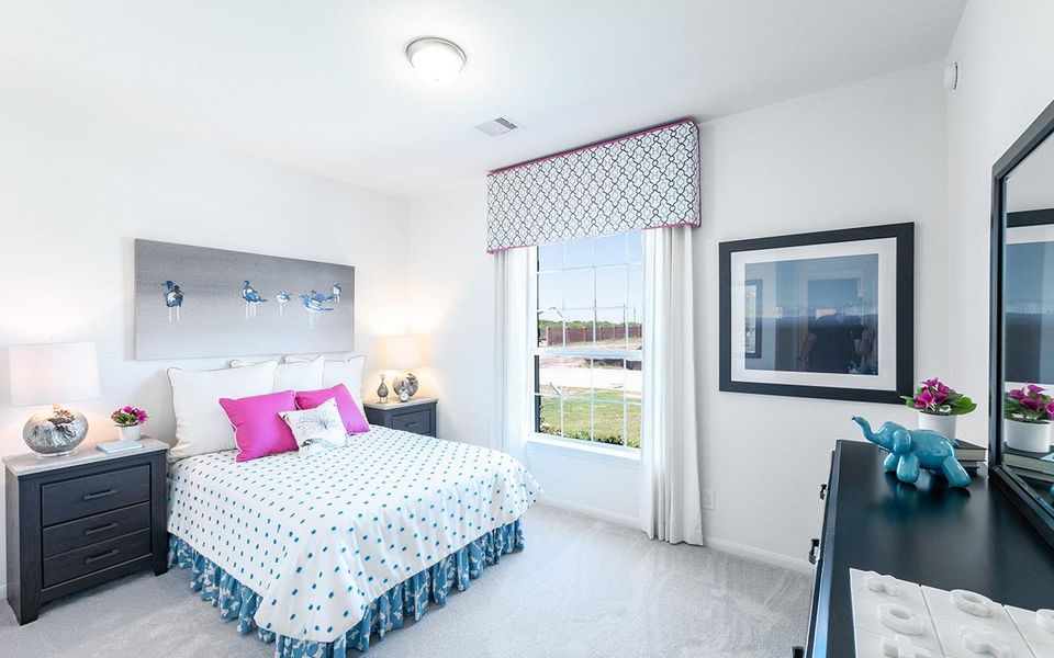 Bedroom with carpet and baseboards Bedroom with carpet and baseboards