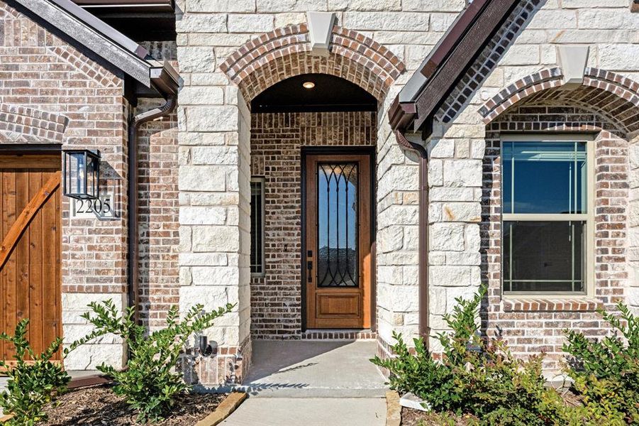 Exterior details and patio area of a home in Stone River Glen 60s, Royse City (Image 4).