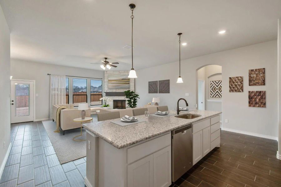 Kitchen & Family Room | Concept 2671 at Mockingbird Hills in Joshua, TX by Landsea Homes