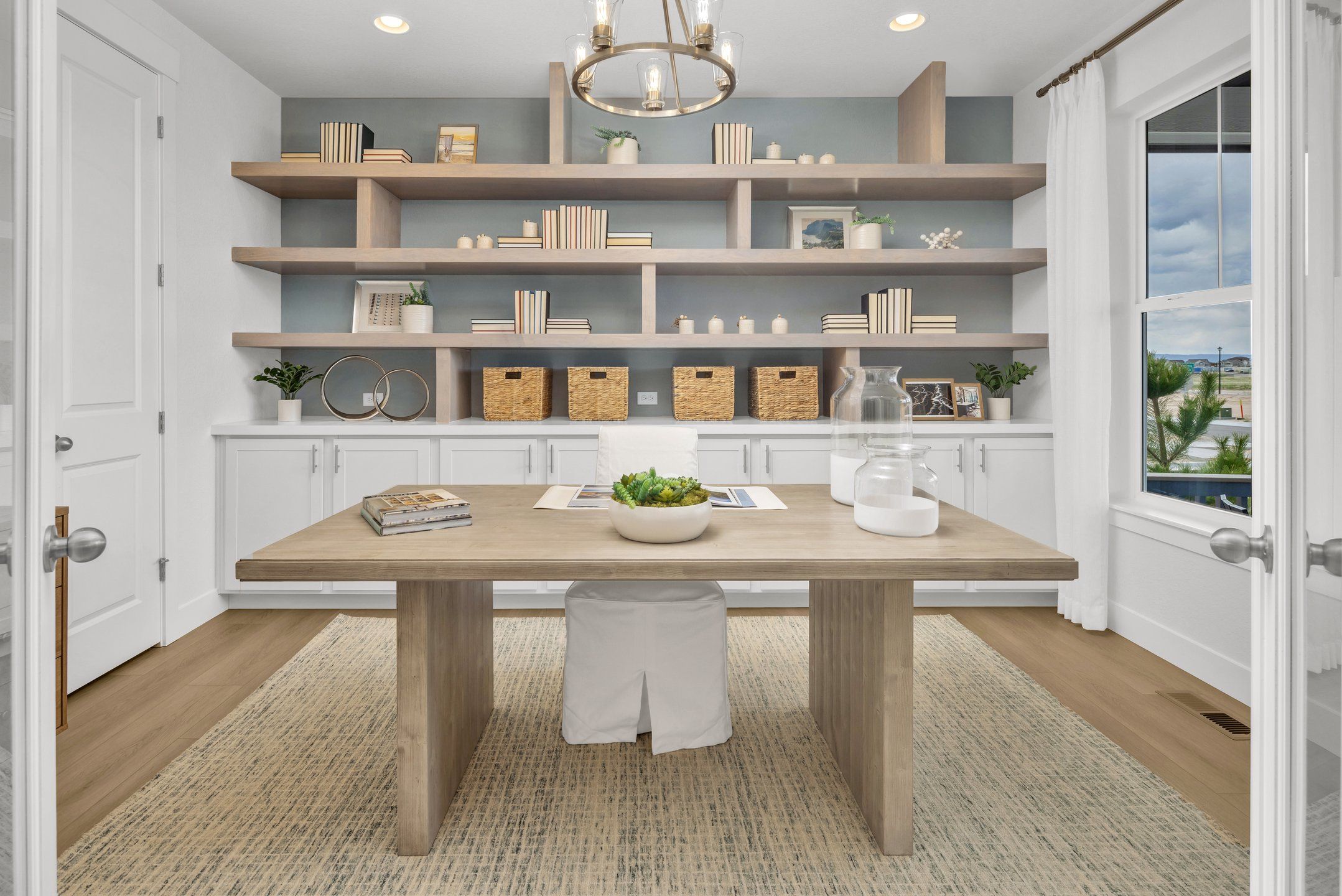 Furnished interior in a model home at Sterling Ranch 50s in Colorado Springs (Image 1).