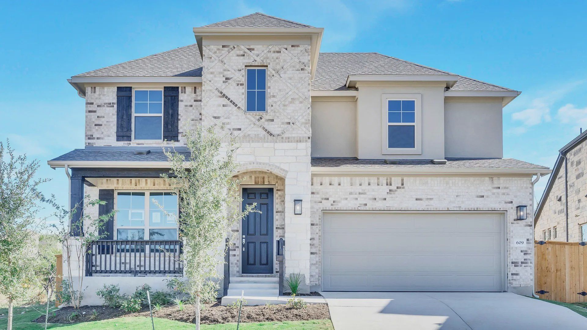 Luxurious brick facade and modern design in the exclusive Mirador community.