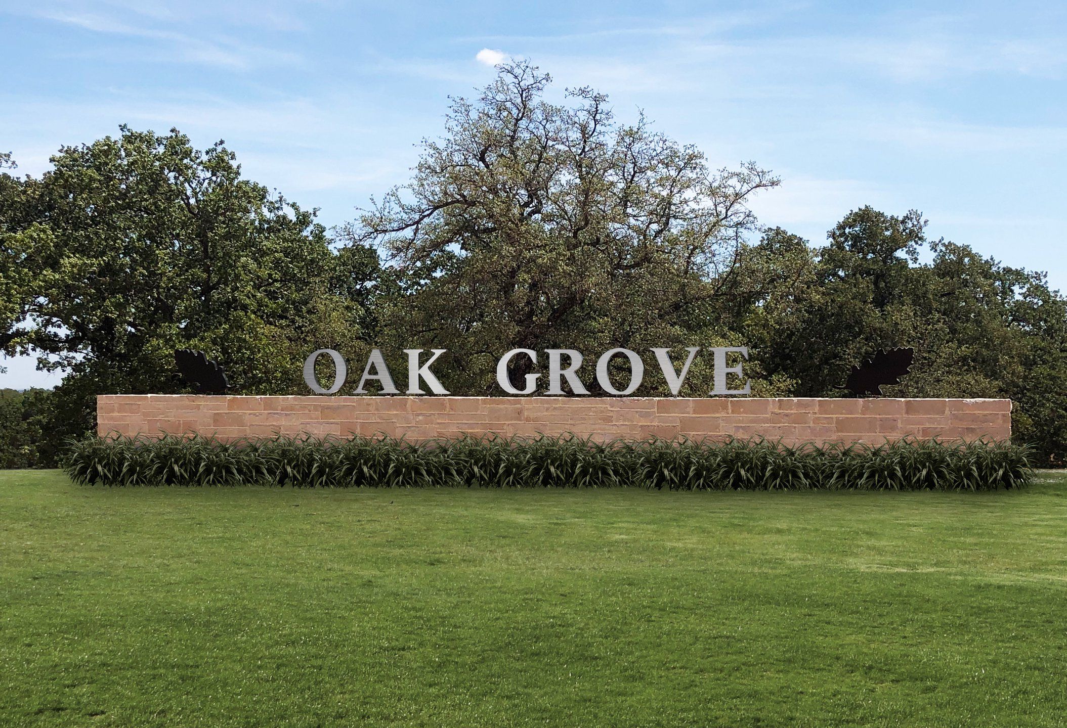 Entrance to the Oak Grove community in Springtown, TX, featuring signage and landscaping (Image 1). Entrance to the Oak Grove community in Springtown, TX, featuring signage and landscaping (Image 1).