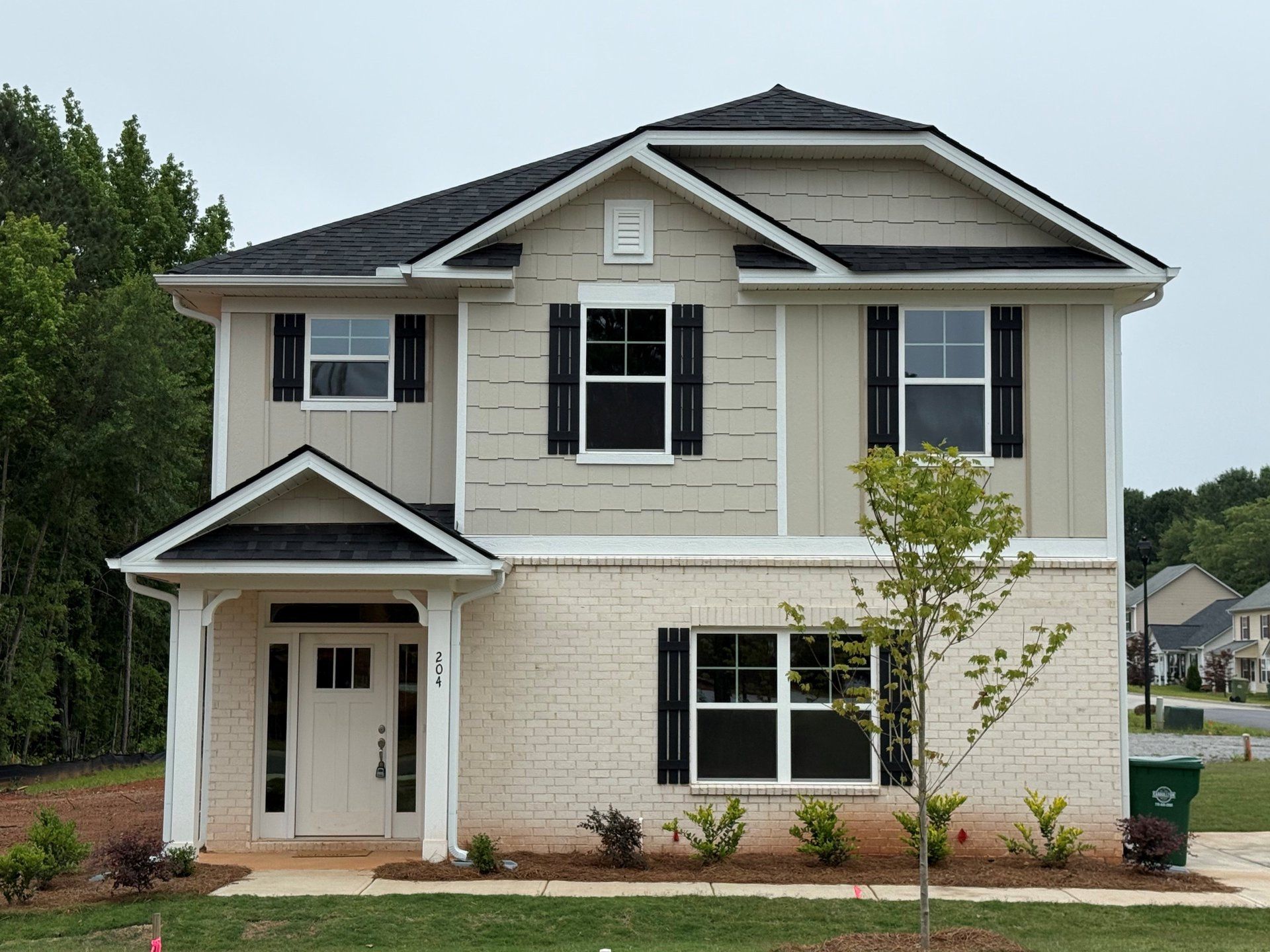 Front exterior of a home in the Canterbury Villas community, located in Carrollton, GA (Image 1).