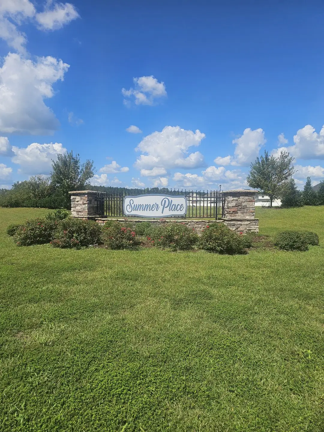 Entrance to the Summer Place community in Grimesland, NC, featuring signage and landscaping (Image 1).