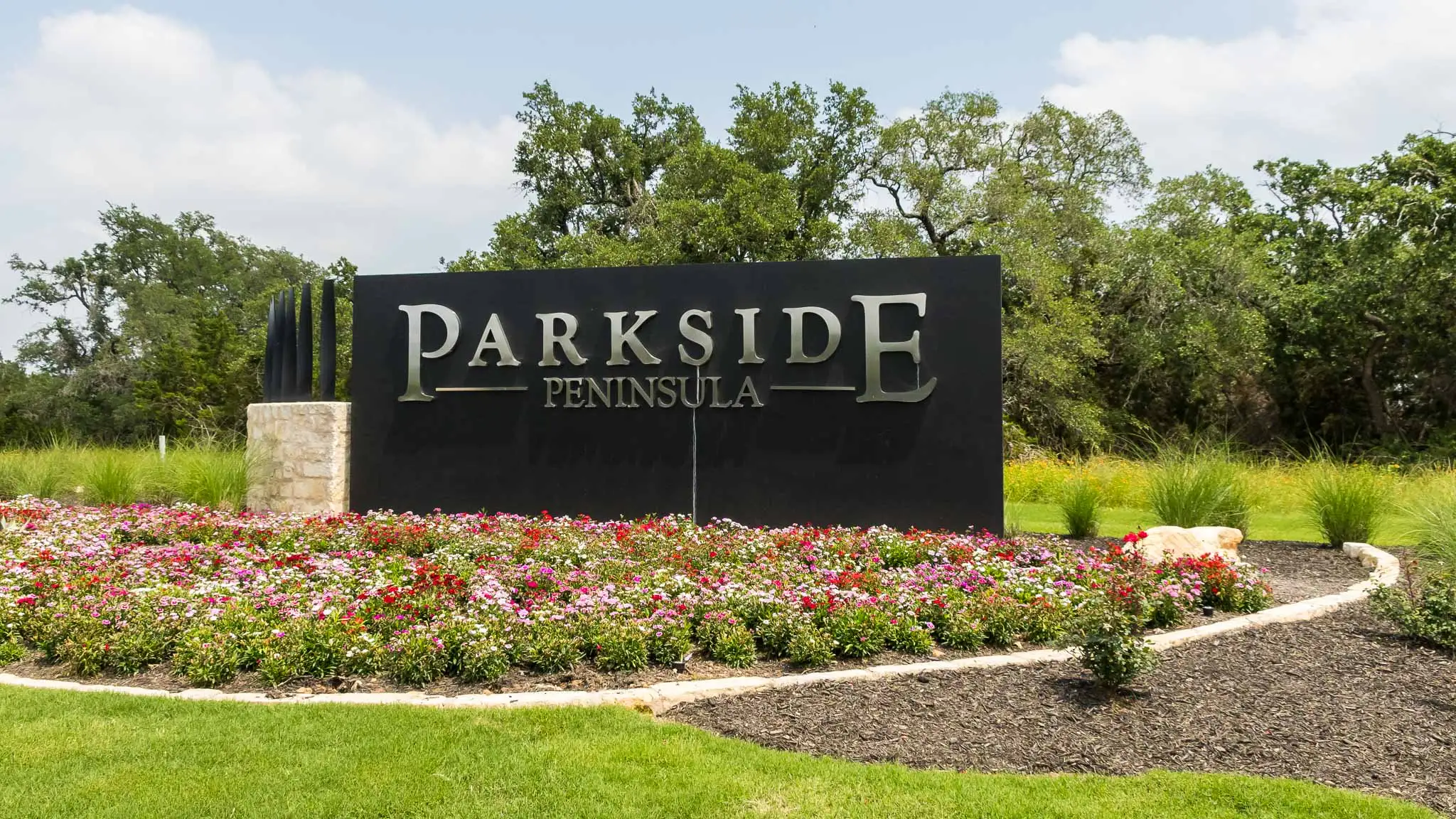 Entrance to the Parkside Peninsula community in Georgetown, TX, featuring signage and landscaping (Image 1). Entrance to the Parkside Peninsula community in Georgetown, TX, featuring signage and landscaping (Image 1).