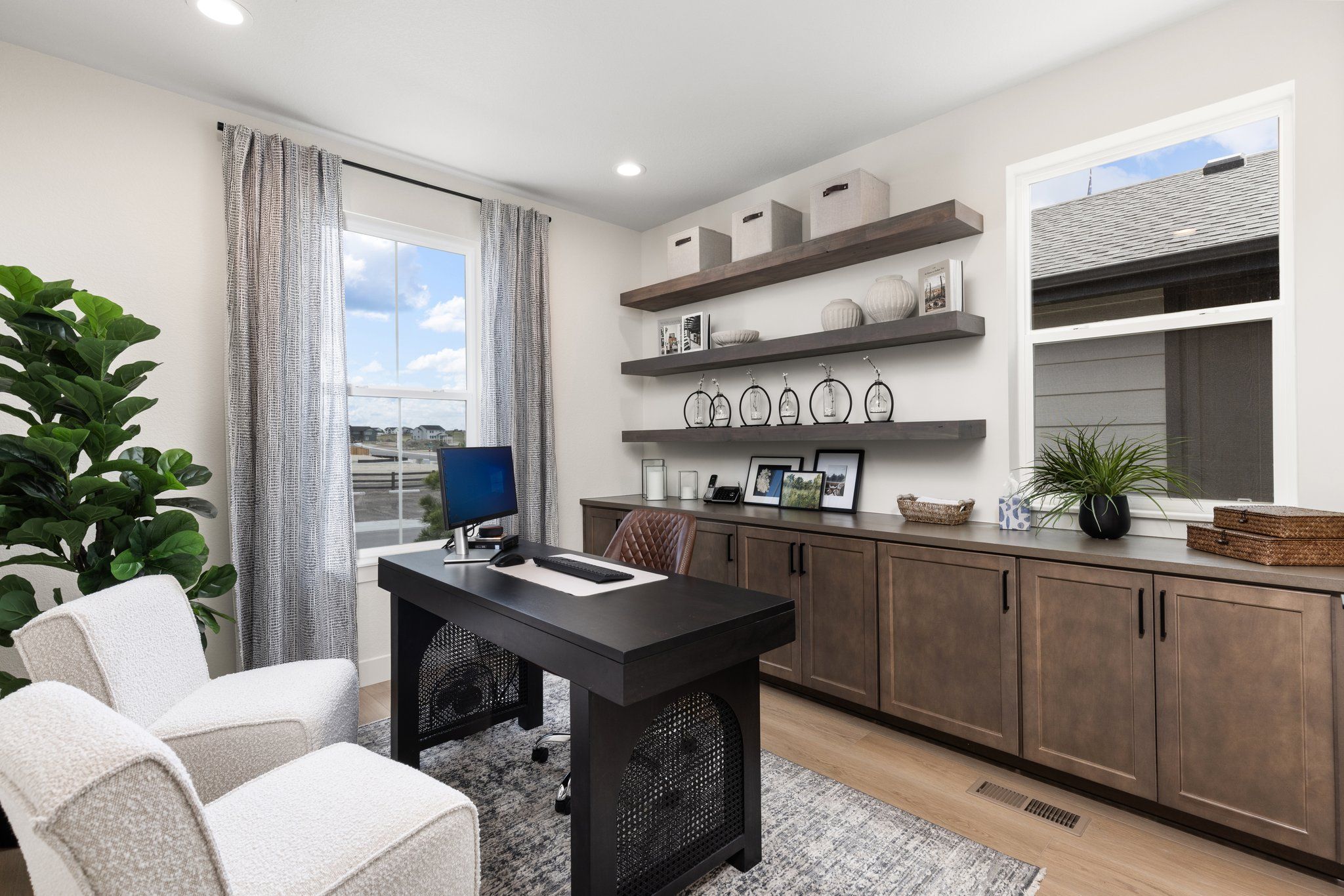 Furnished interior in a model home at Sterling Ridge 60s in Sterling in Colorado Springs (Image 1).