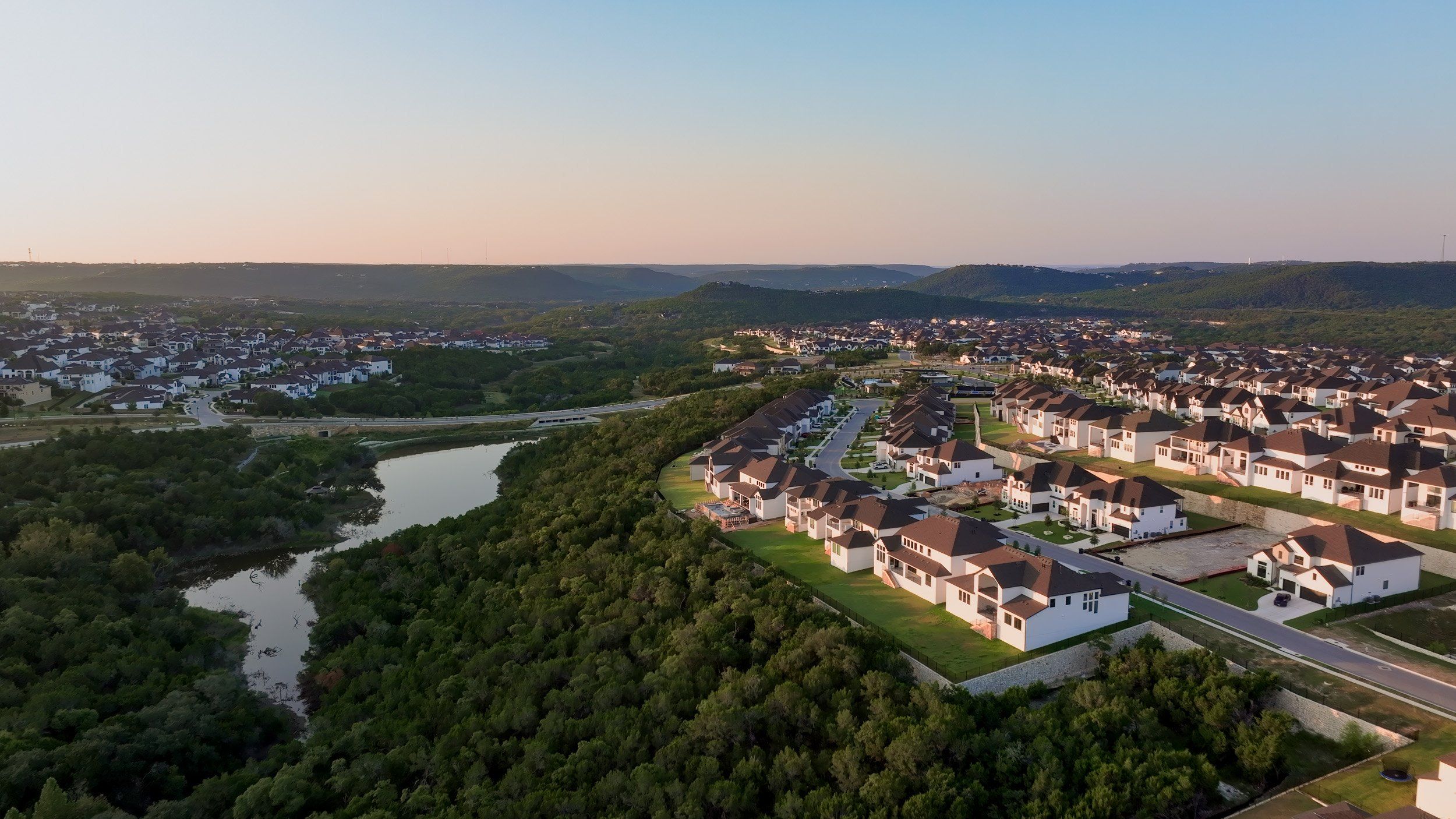 Aerial view of the Travisso community in Leander, TX, showing layout and nearby surroundings (Image 1). Aerial view of the Travisso community in Leander, TX, showing layout and nearby surroundings (Image 1).