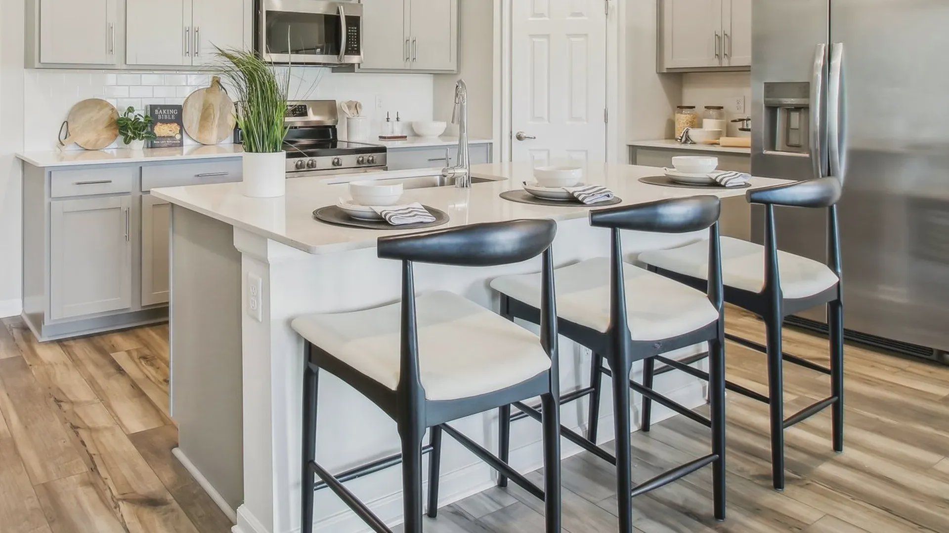 Experience luxury with sleek cabinetry, stainless steel appliances, and elegant island seating in Surprise City Center. Experience luxury with sleek cabinetry, stainless steel appliances, and elegant island seating in Surprise City Center.