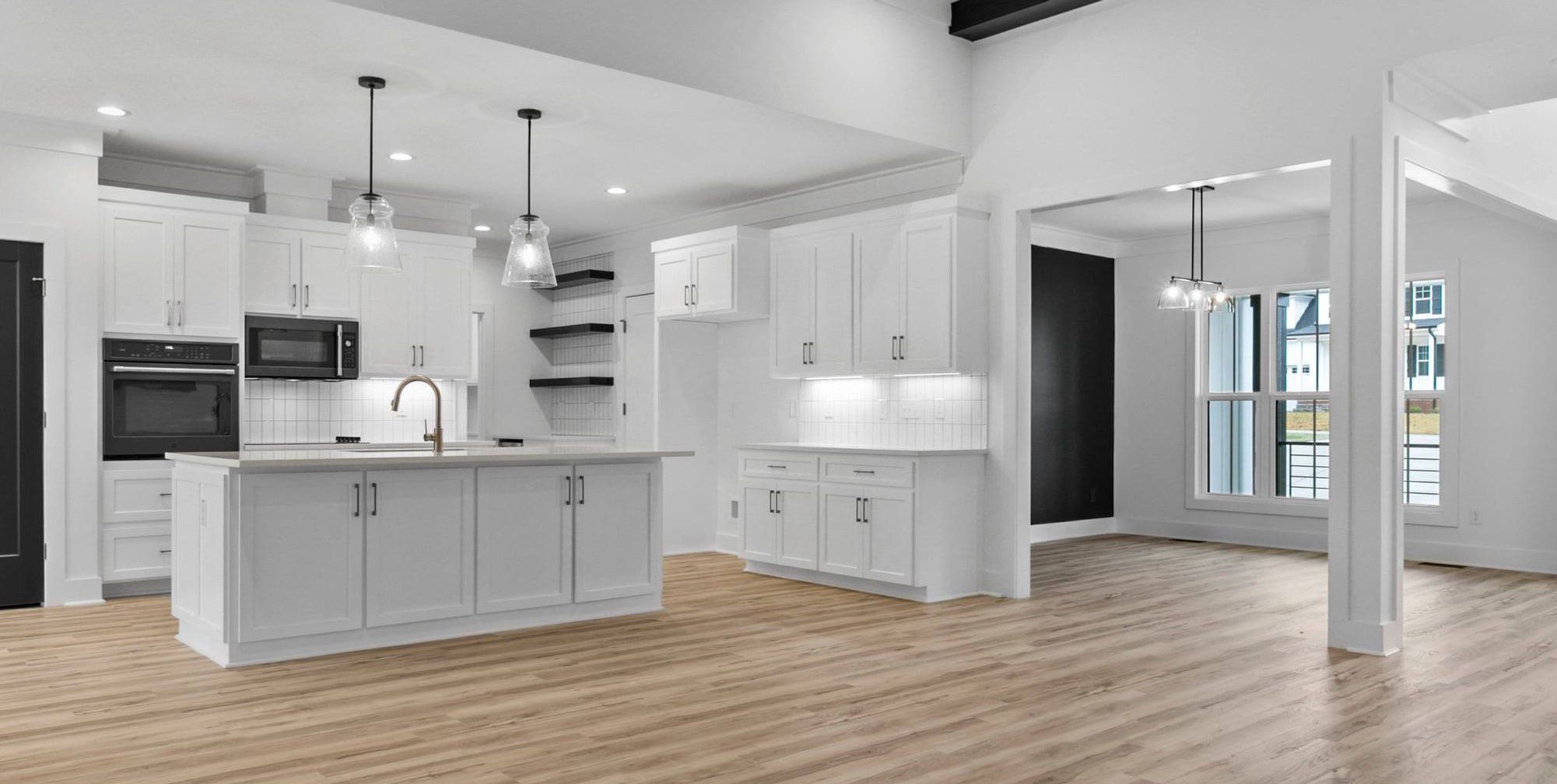 Furnished interior in a model home at Reese Ridge in Willow Spring (Image 1).