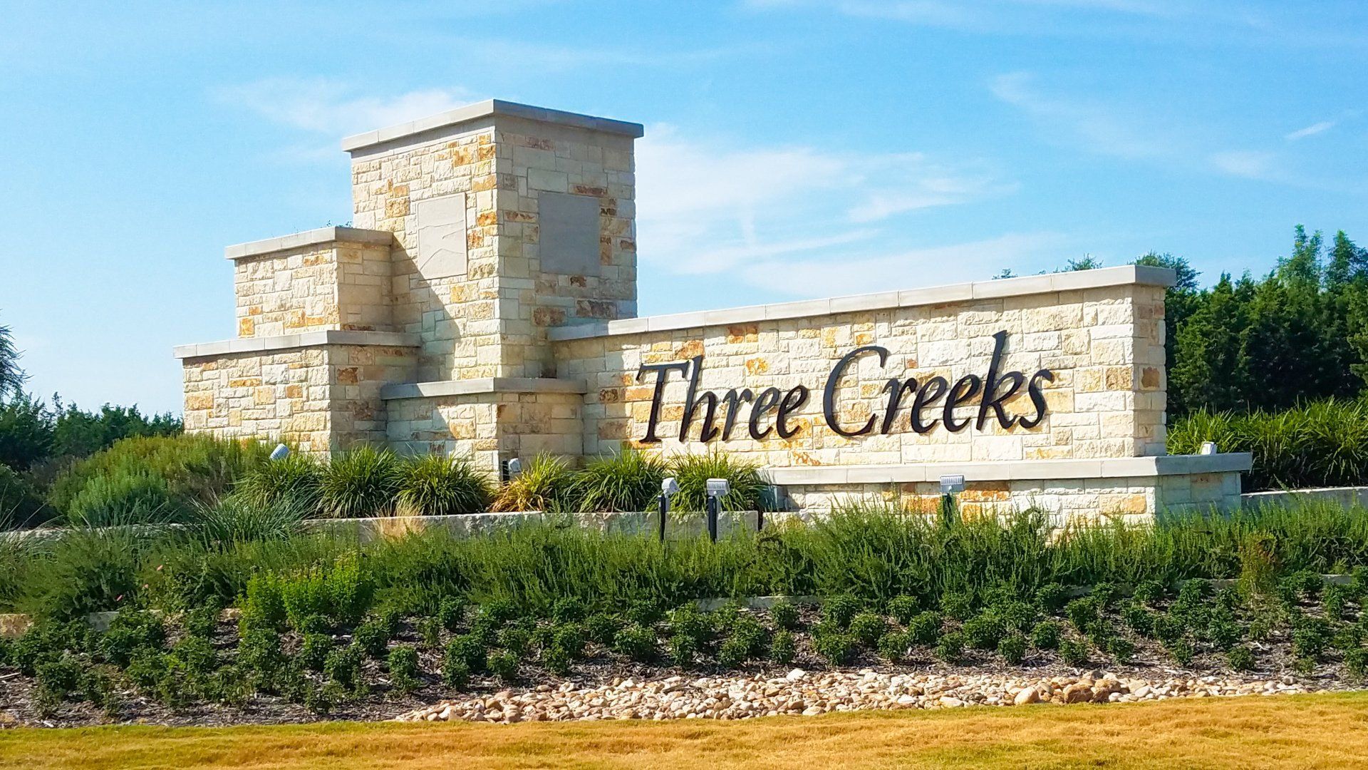 Entrance to the Three Creeks community in Austin, TX, featuring signage and landscaping (Image 1). Entrance to the Three Creeks community in Austin, TX, featuring signage and landscaping (Image 1).