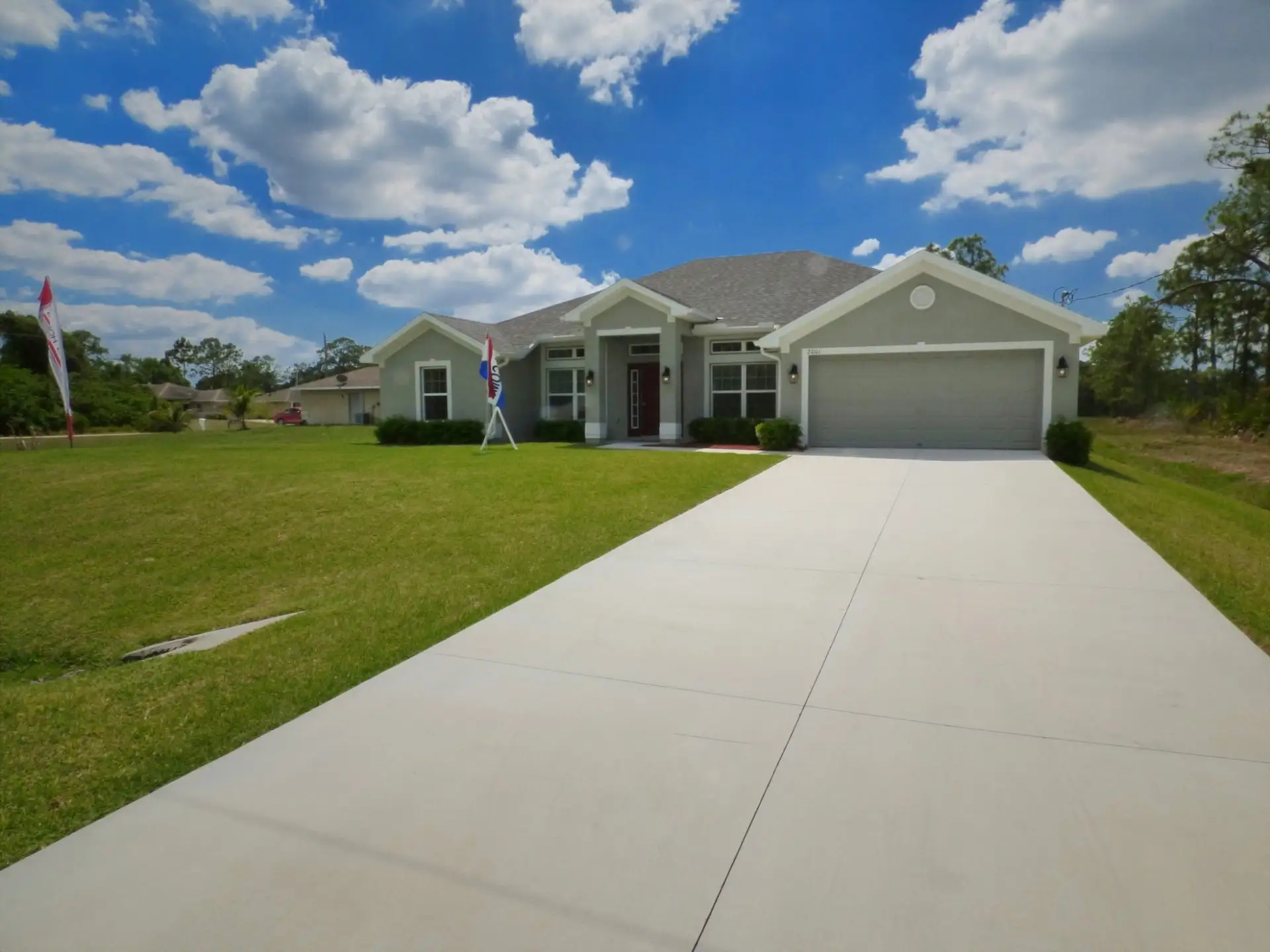 Front exterior of a home in the Port Charlotte community, located in Port Charlotte, FL (Image 1).