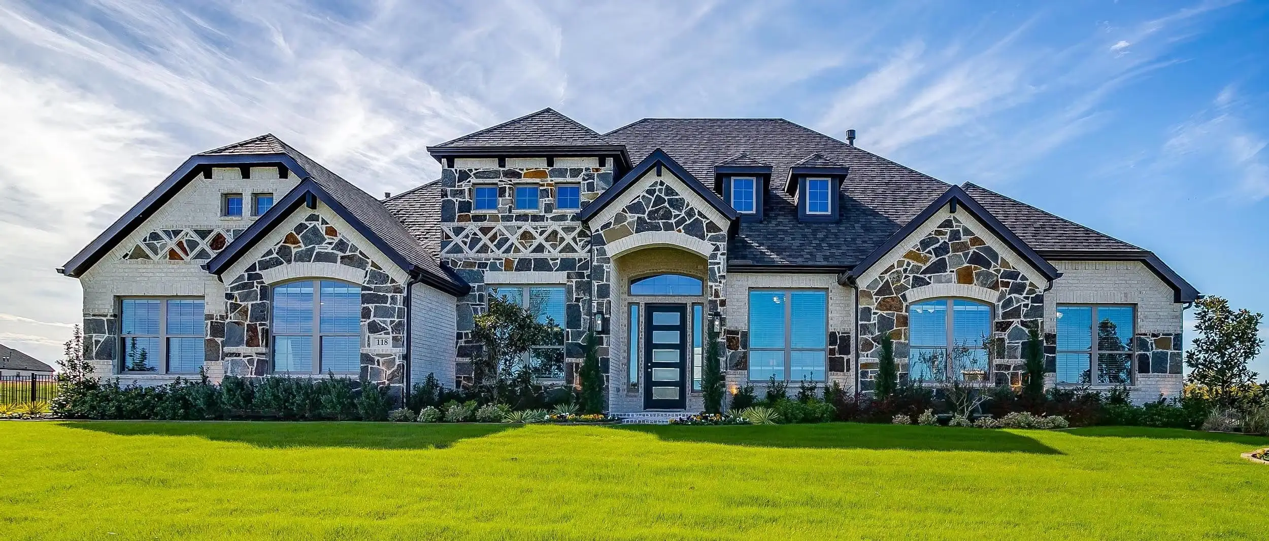 Front exterior of a home in the Heritage community, located in Heath, TX (Image 1).