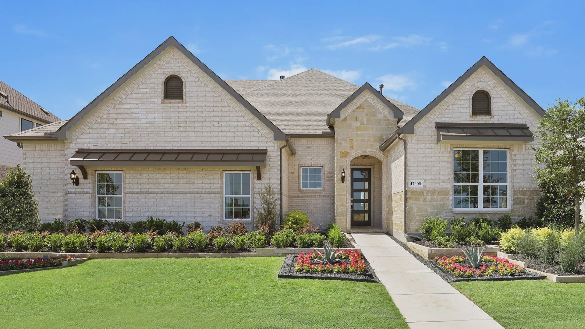 Luxurious arched windows and meticulously landscaped garden in Lakeshore Bluffs. Luxurious arched windows and meticulously landscaped garden in Lakeshore Bluffs.