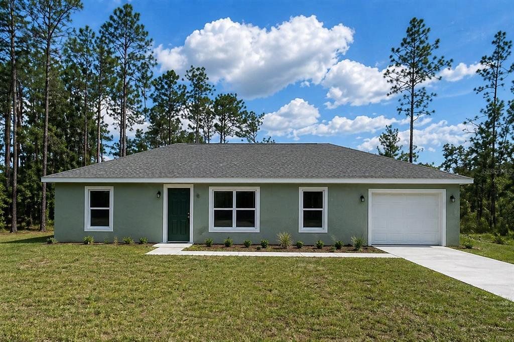 Front exterior of a new home in , Dunnellon, FL, highlighting curb appeal (Image 1). Front exterior of a new home in , Dunnellon, FL, highlighting curb appeal (Image 1).