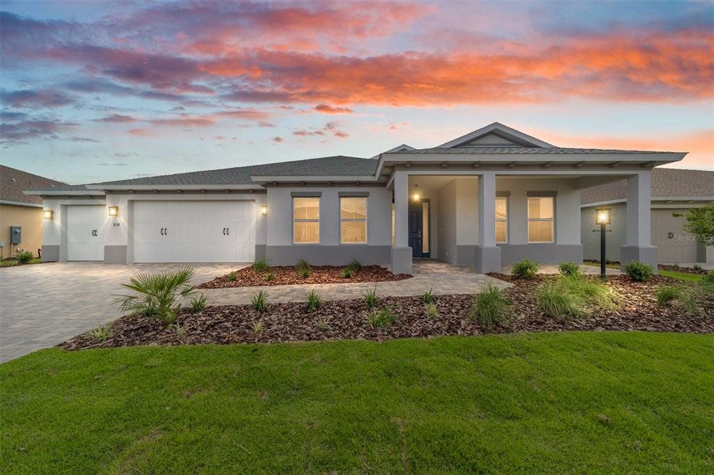 Front exterior of a new home in On Top of the World Communities, Ocala, FL, highlighting curb appeal (Image 1). Front exterior of a new home in On Top of the World Communities, Ocala, FL, highlighting curb appeal (Image 1).