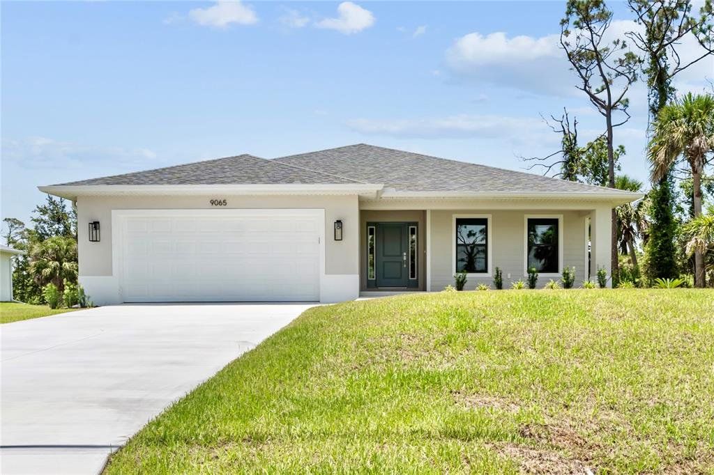 Front exterior of a new home in , Englewood, FL, highlighting curb appeal (Image 1). Front exterior of a new home in , Englewood, FL, highlighting curb appeal (Image 1).