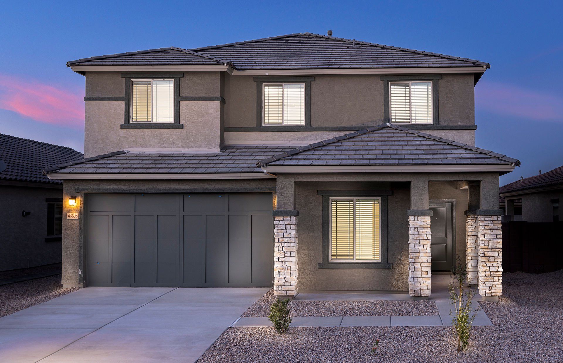 Front exterior of a new home in Copper Falls, Buckeye, AZ, highlighting curb appeal (Image 1). Front exterior of a new home in Copper Falls, Buckeye, AZ, highlighting curb appeal (Image 1).