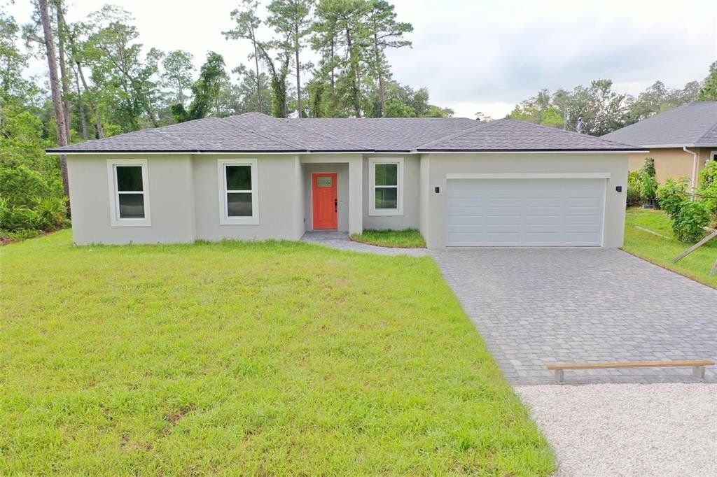 Front exterior of a new home in , Deland, FL, highlighting curb appeal (Image 1). Front exterior of a new home in , Deland, FL, highlighting curb appeal (Image 1).