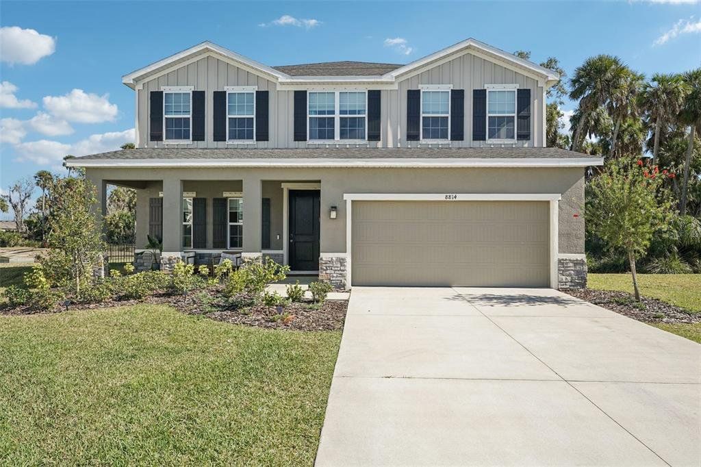 Front exterior of a new home in , Parrish, FL, highlighting curb appeal (Image 1). Front exterior of a new home in , Parrish, FL, highlighting curb appeal (Image 1).