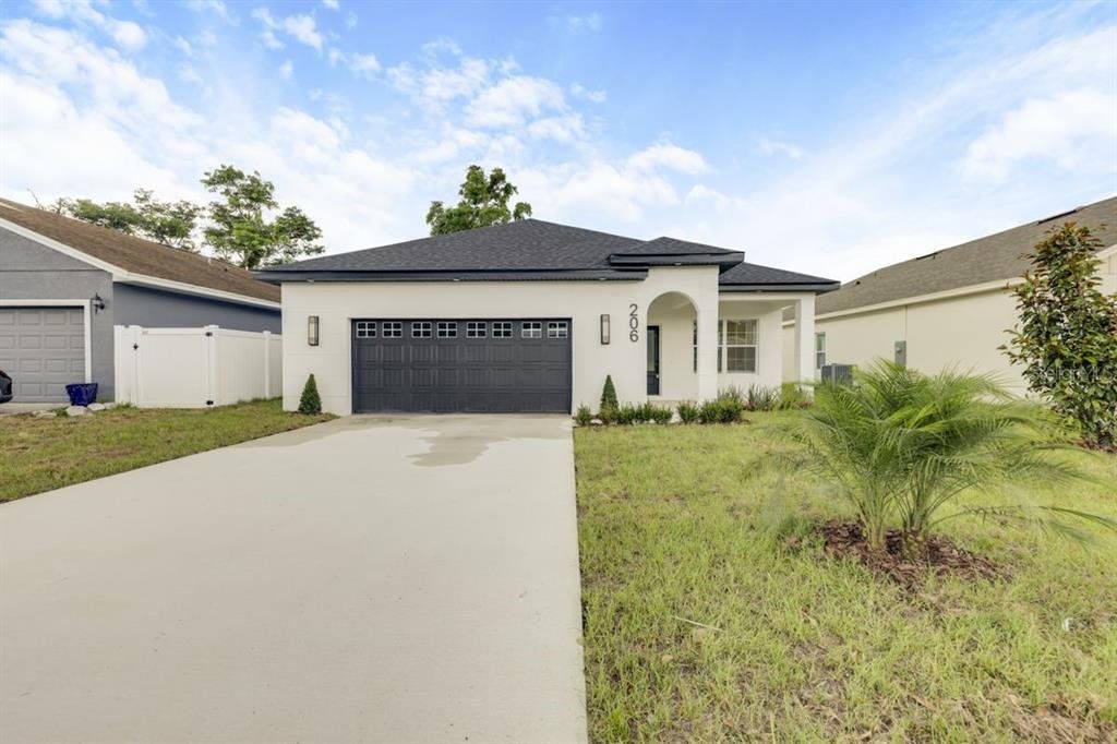 Front exterior of a new home in , Maitland, FL, highlighting curb appeal (Image 1). Front exterior of a new home in , Maitland, FL, highlighting curb appeal (Image 1).