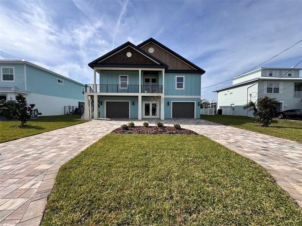 Front exterior of a new home in , Hernando Beach, FL, highlighting curb appeal (Image 1). Front exterior of a new home in , Hernando Beach, FL, highlighting curb appeal (Image 1).