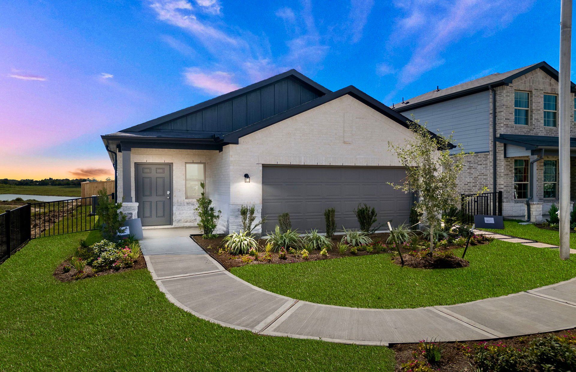 Front exterior of a new home in River Ranch, Dayton, TX, highlighting curb appeal (Image 1).
