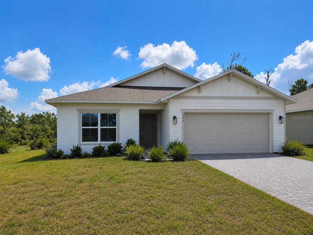 Front exterior of a new home in , Rotonda West, FL, highlighting curb appeal (Image 1). Front exterior of a new home in , Rotonda West, FL, highlighting curb appeal (Image 1).