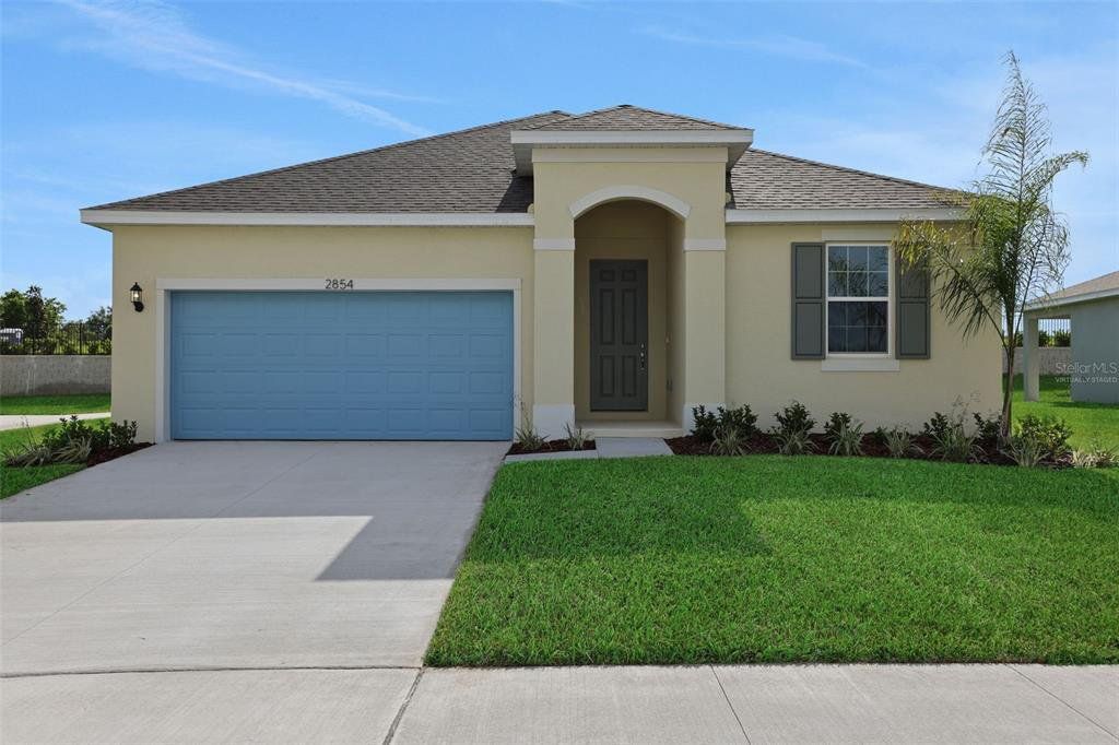 Front exterior of a new home in Seaport Village, Tavares, FL, highlighting curb appeal (Image 1). Front exterior of a new home in Seaport Village, Tavares, FL, highlighting curb appeal (Image 1).