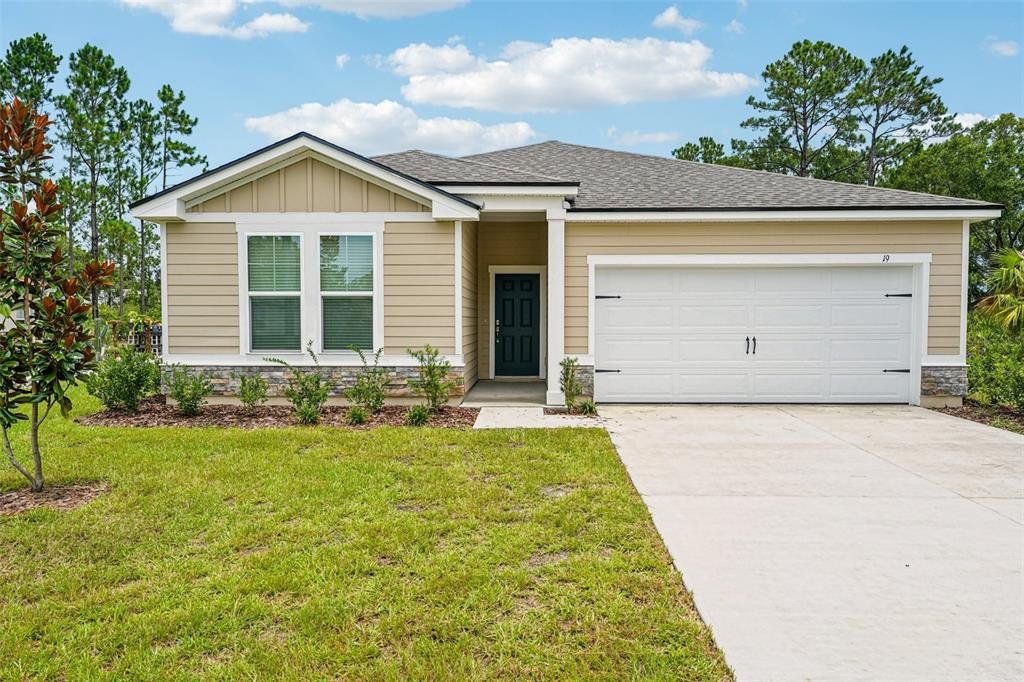 Front exterior of a new home in , Palm Coast, FL, highlighting curb appeal (Image 1). Front exterior of a new home in , Palm Coast, FL, highlighting curb appeal (Image 1).