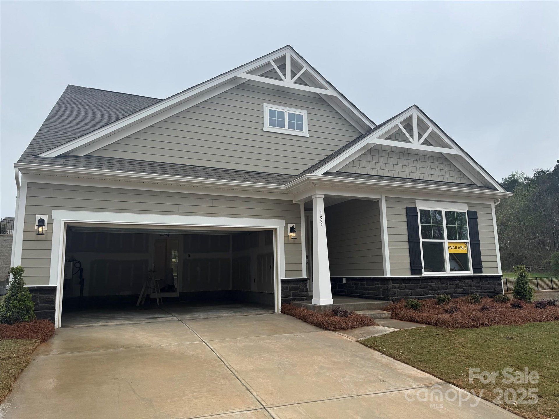 Front exterior of a new home in Villas at Prestwick, Mooresville, NC, highlighting curb appeal (Image 1). Front exterior of a new home in Villas at Prestwick, Mooresville, NC, highlighting curb appeal (Image 1).