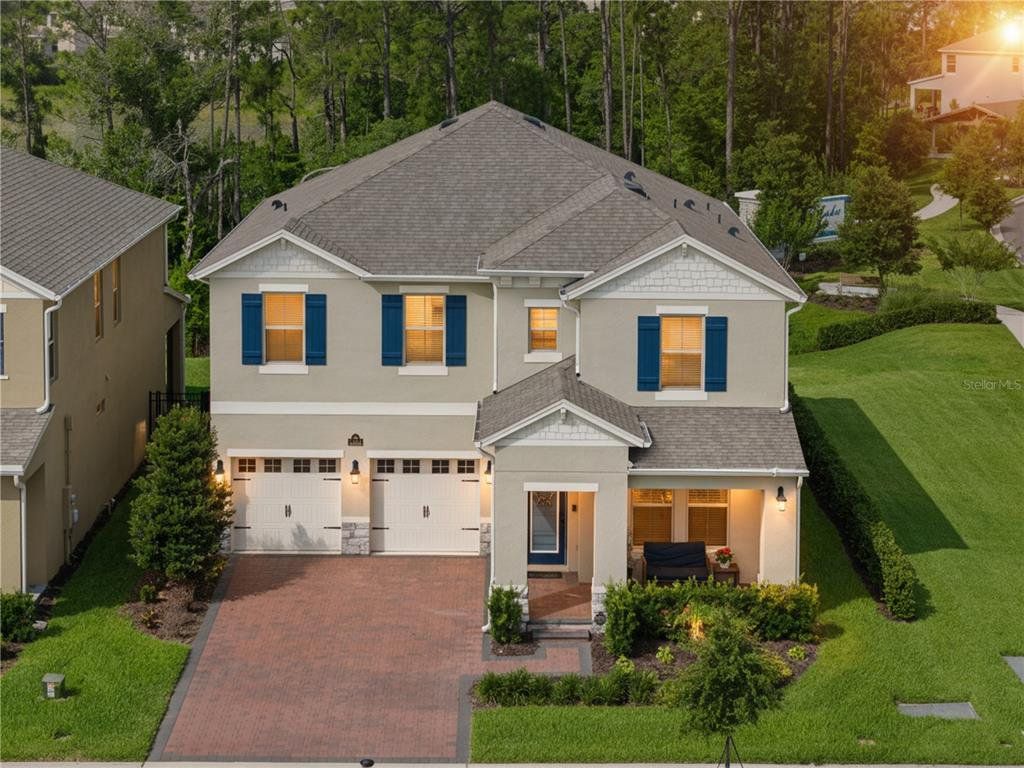 Front exterior of a new home in , Winter Garden, FL, highlighting curb appeal (Image 1). Front exterior of a new home in , Winter Garden, FL, highlighting curb appeal (Image 1).